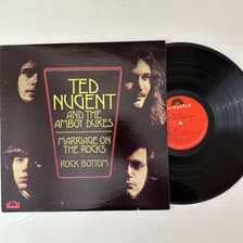 Tumnagel för auktion "Ted Nugent And The Amboy Dukes – Marriage On The Rocks / Rock Bottom LP"