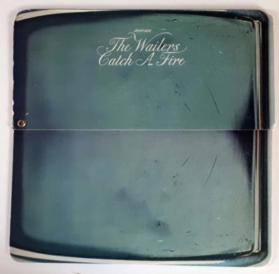 Tumnagel för auktion "The Wailers- Catch A Fire UK 1973 very rare Zippo Sleeve Bob Marley"