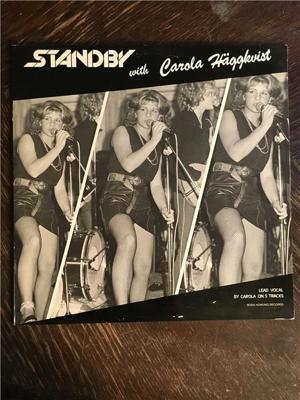 Tumnagel för auktion "STANDBY - With Carola Häggkvist. RÖD VINYL! Svensk Metal! Toppskick! LP"