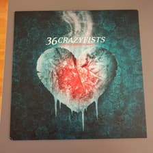 Tumnagel för auktion "36 Crazyfists - A Snow Capped Romance 1x LP Vinyl - Numetal Metal Rock ny"