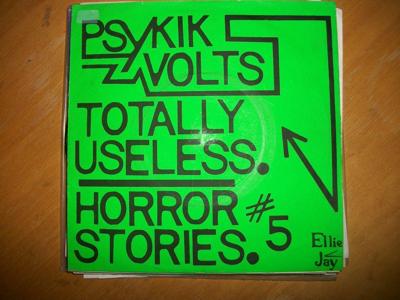 Tumnagel för auktion "Psykik Volts 7"; UK KBD DIY Punk, Teenage Treats; Ellie Jay "Totally Useless""