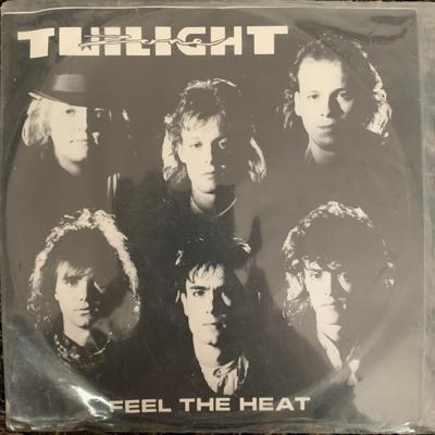 Tumnagel för auktion "TWILIGHT ZONE Feel the Heat 7" / '89 Svensk Hårdrock"