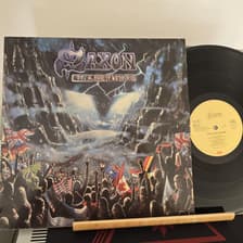 Tumnagel för auktion "Saxon – Rock The Nations EU 1986 + INNERSLEEVE"