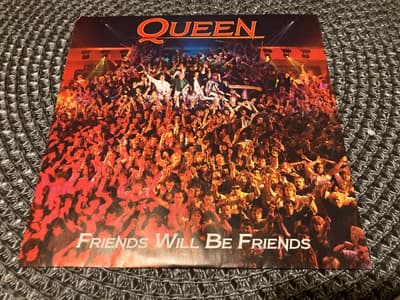 Tumnagel för auktion "Queen - Friends will be friends, 7” Vinylsingel"