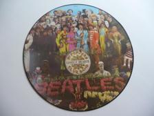 Tumnagel för auktion "THE BEATLES – Sgt. Pepper's Lonely Hearts Club Band - Picture Disc LP 1979"