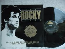 Tumnagel för auktion "V/A - THE ROCKY STORY - SCOTTI BROS 848 242-1"