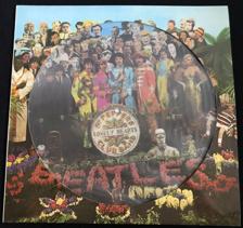 Tumnagel för auktion "BEATLES Sgt Peppers Lonely Hearts Club Band PICTURE DISC Die Cut sleev Laminerad"