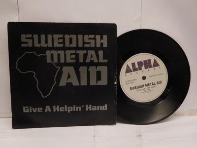 Tumnagel för auktion "SWEDISH METAL AID - GIVE A HELPIN´ HAND - V/A"