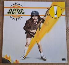 Tumnagel för auktion "AC/DC High Voltage Lp + Let there be rock Cd."