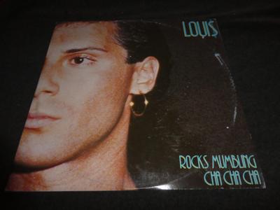 Tumnagel för auktion "Loui$ – Rocks Mumbling Cha Cha Cha - ITA 12" - 1986 - Italo-Disco"