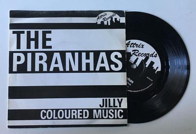 Tumnagel för auktion "The Piranhas ”Jilly / Coloured Music” 1979 debut DIY KBD TVP"