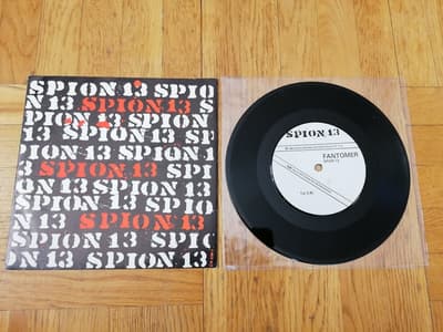 Tumnagel för auktion "Spion 13 – Fantomer, 7" (Rosa Honung Records, 1983) med pressblad"