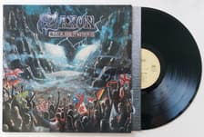 Tumnagel för auktion "SAXON - Rock the nation TYS orginal EX/VG+"