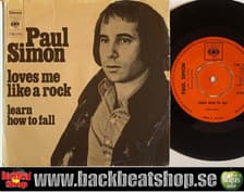 Tumnagel för auktion "PAUL SIMON - LOVES ME LIKE A ROCK"