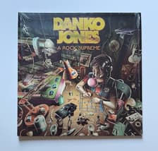 Tumnagel för auktion "Danko Jones - A Rock Supreme (2019) Neon Orange vinyl"