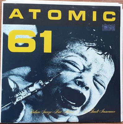 Tumnagel för auktion "Atomic 61 – Deluxe Snooze-Bar Alarm / No Fault Insurance blue vinyl"