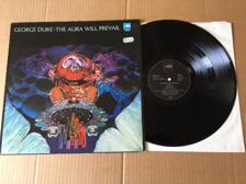 Tumnagel för auktion "George Duke - The Aura Will Prevail Ger Orig-75 EX !!!!!"