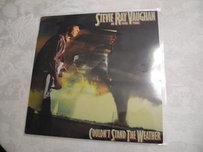 Tumnagel för auktion "Stevie Ray Vaughan And Double Trouble Couldn`t Stand The Weather LP"