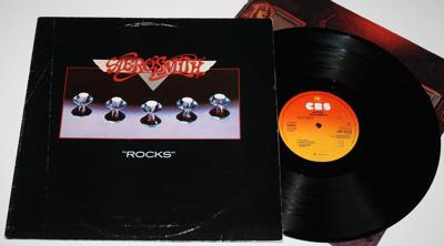Tumnagel för auktion "AEROSMITH - LP – ROCKS – 1976"
