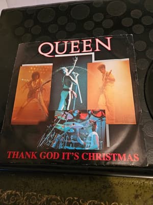 Tumnagel för auktion "Queen si 1984 thank god it's christmas"