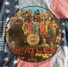 Tumnagel för auktion "The Beatles - SGT. Pepper’s Lonely Hearts Club Band (Picture Disc / LP / Vinyl)."