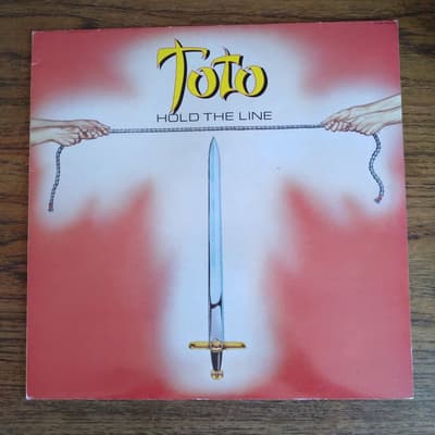 Tumnagel för auktion "Toto - Hold the line UK-84 Ex/Vg+"