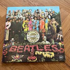 Tumnagel för auktion "The Beatles - Sgt Pepper’s Lonely Hearts Club Band. Apple Japan 1976"