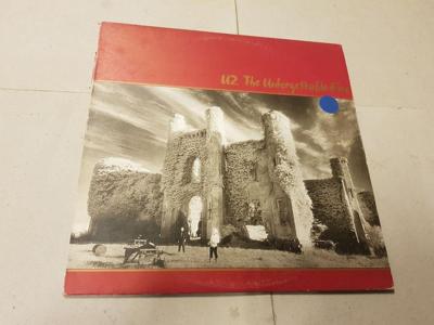 Tumnagel för auktion "U2 - The Unforgettable Fire LP SWE-84"