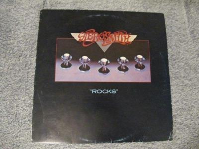 Tumnagel för auktion "Aerosmith - Rocks vinyl från 1976"