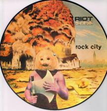 Tumnagel för auktion "RIOT - ROCK CITY PICTURE DISC LP"