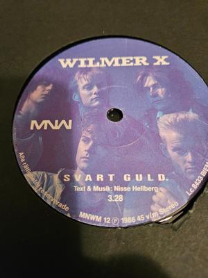 Tumnagel för auktion "Wilmer x maxi 1986 svart guld"