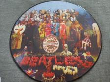 Tumnagel för auktion "Beatles - Sgt peppers lonely hearts club band  - PIC DISC"