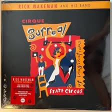 Tumnagel för auktion "RICK WAKEMAN AND HIS BAND - CIRQUE SURREAL. VINYL LP - 19. PROG-ROCK. INPLASTAD"