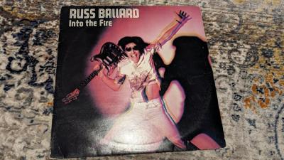 Tumnagel för auktion "Russ Ballard – Into The Fire"
