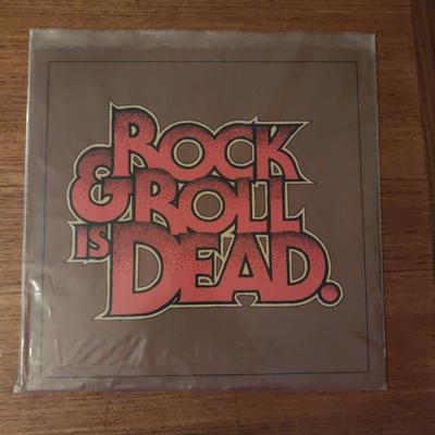 Tumnagel för auktion "The Hellacopters Rock & roll is dead 12" vinyl"