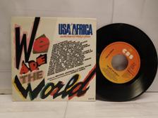 Tumnagel för auktion "USA FOR AFRICA - WE ARE THE WORLD - V/A"