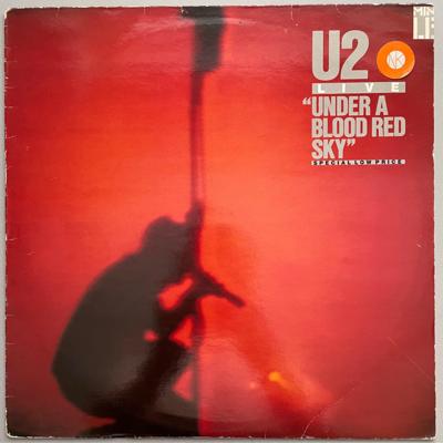 Tumnagel för auktion "U2 • Live at Red Rocks: Under a Blood Red Sky • {Bra Skick/1983, LP}"