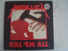 Tumnagel för auktion "Metallica - Kill 'Em All. MFN 7 DM 1983 UK"