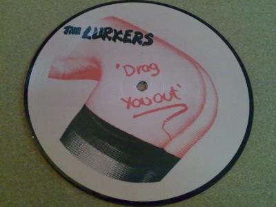 Tumnagel för auktion "The Lurkers : DRAG YOU OUT ,, HEROIN  ( 7'' Bild-Singel , UK press )"
