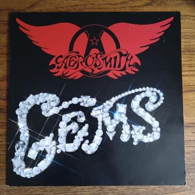 Tumnagel för auktion "Aerosmith - Gems HOL-88 Vg++/Vg++"