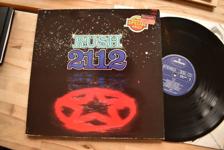 Tumnagel för auktion "Rush 2112 LP progg rock Neil Peart"