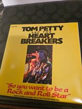 Tumnagel för auktion "Tom Petty and the heartbreakers si 1985 so you want to be a rock and roll star"