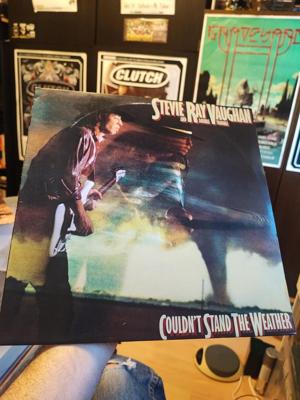 Tumnagel för auktion "Stevie Ray Vaughan and Double Trouble couldn't stand the weather, lp 1984"