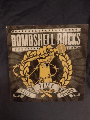 Tumnagel för auktion "BOMBSHELL ROCKS"