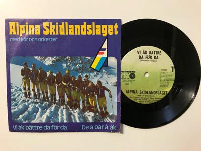 Tumnagel för auktion "Alpina skidlandslaget - Vi åk bättre da för da/De ä bar å åk"