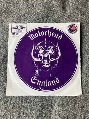 Tumnagel för auktion "Motörhead Leavin Here / White line fever 7” Blitz records"