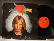 Tumnagel för auktion "TOM PETTY & THE HEARTBREAKERS - ROCKIN´AROUND (WITH YOU - PORTUGAL PRESS)"