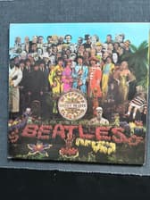 Tumnagel för auktion "The Beatles-Sgt. Pepper's Lonely Hearts Club Band,UK 1:st press laminated sleeve"