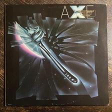 Tumnagel för auktion "AXE - Same 1979. Rare Promo Press! Första LPn’ AOR. Prog-Rock. LP"